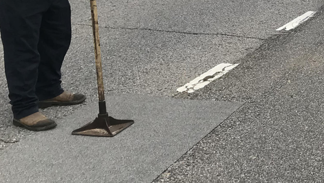 Tamping down american road patch