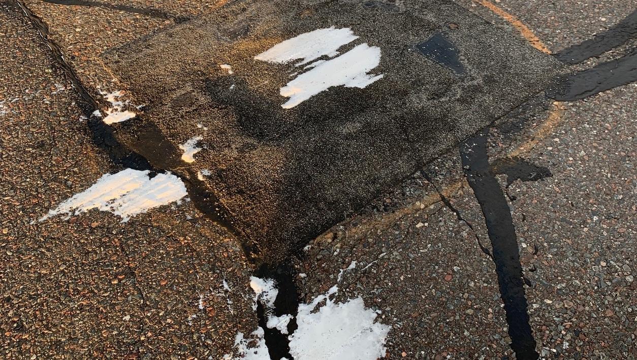 Snow on top of american road patch