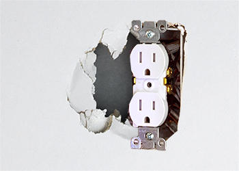 hole_near_electrical_outlet